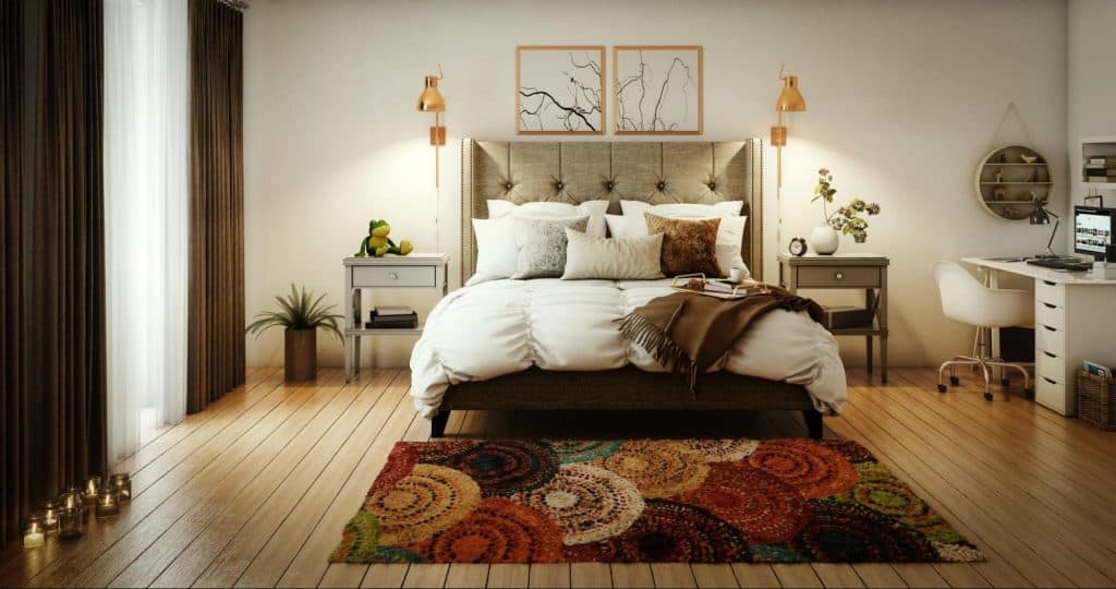 A comforter and pillows on a bed in master bedroom with beautiful interior