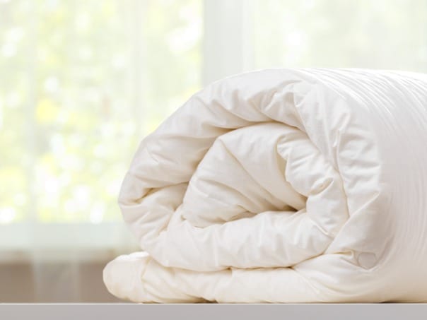 https://www.nectarsleep.com/wp-content/uploads/2022/03/folded-rolls-duvet-is-lying-on-the-dresser-against-the-background-of-picture-id1161232231-1.jpg