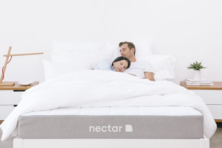 couple sleeping on nectar mattress